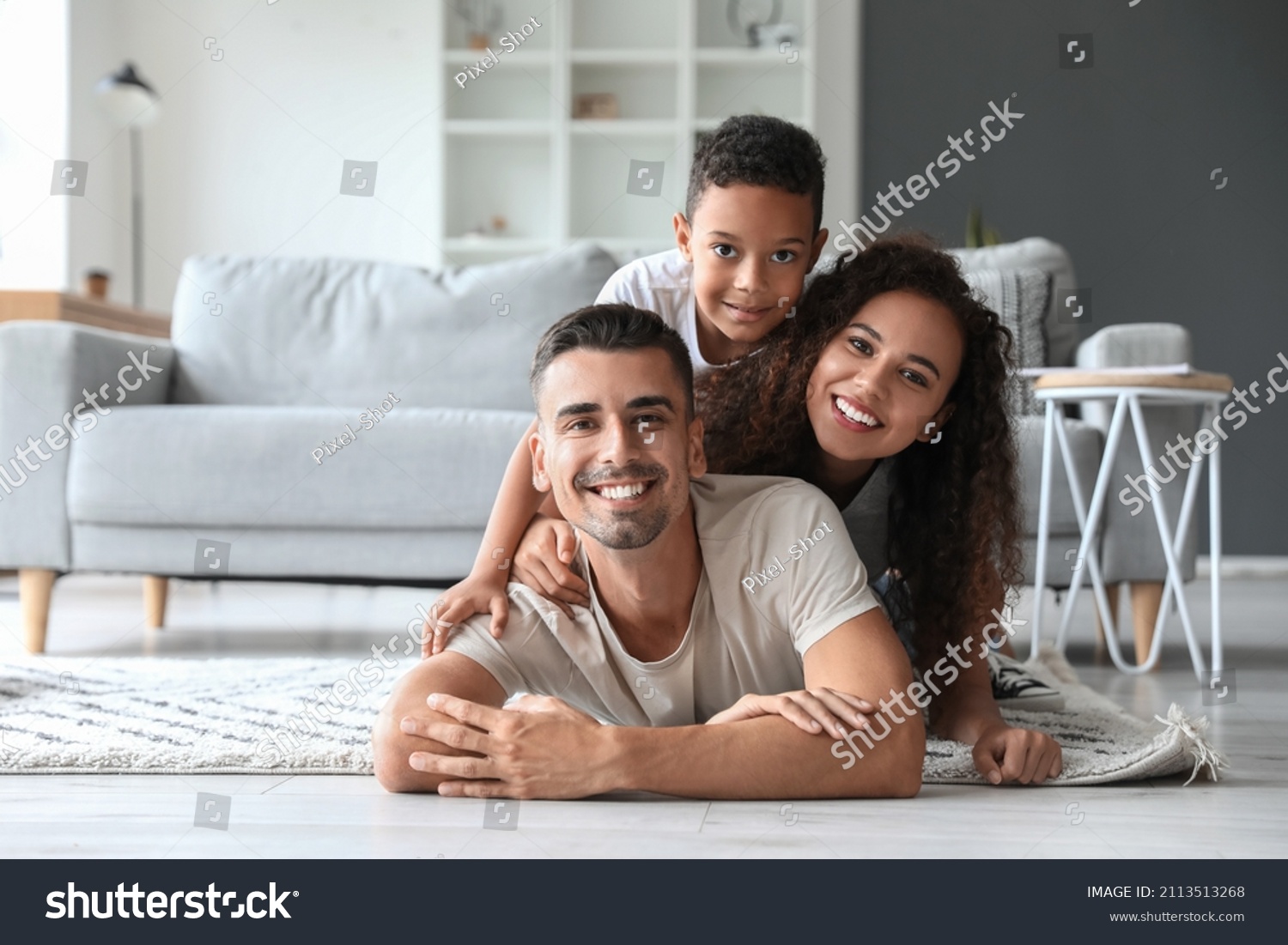 Happy interracial family at home #2113513268