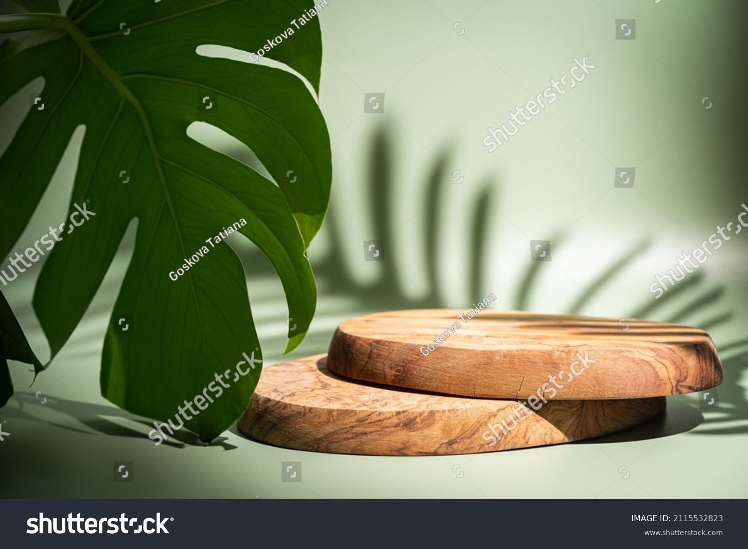 Wooden podium with leaves and shadows. Realistic wood platform for product presentation. Minimal nature scene with pedestal mockup. cosmetic display or award ceremony #2115532823