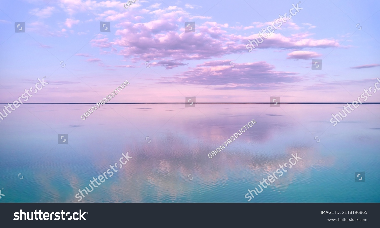 Stunning pink-purple sunrise on the Kiev Sea. Seascape with azure water and purple clouds in reflection. Tourism and recreation. #2118196865