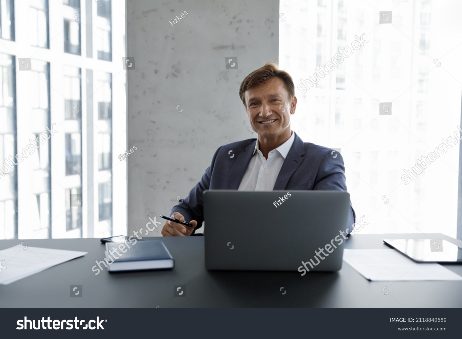 Happy mature businessman, company executive, CEO head shot portrait. Male business leader, professional, project owner sitting at work desk, laptop computer, looking at camera, smiling, #2118840689