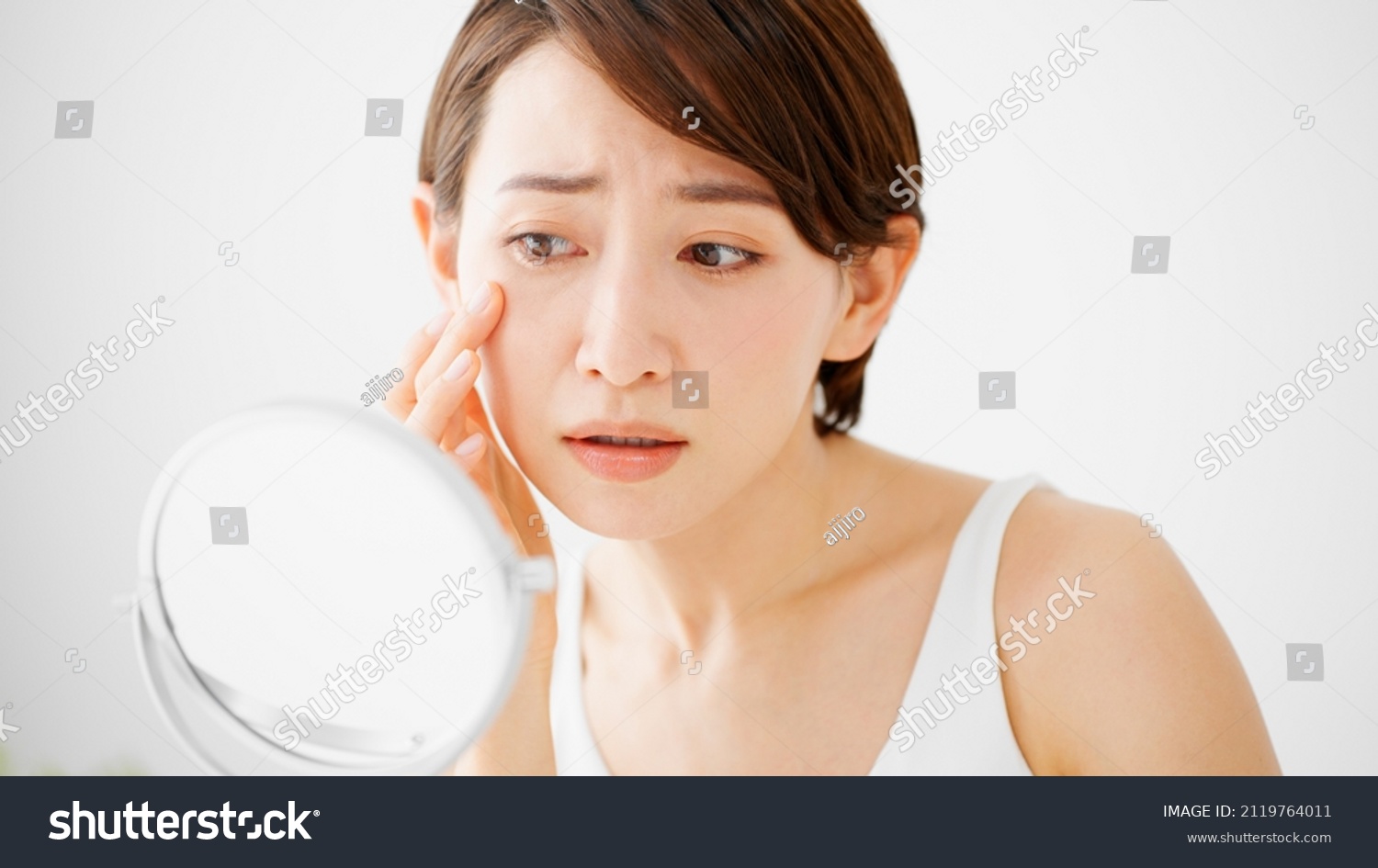 Beauty Image of young woman taking care of her skin #2119764011