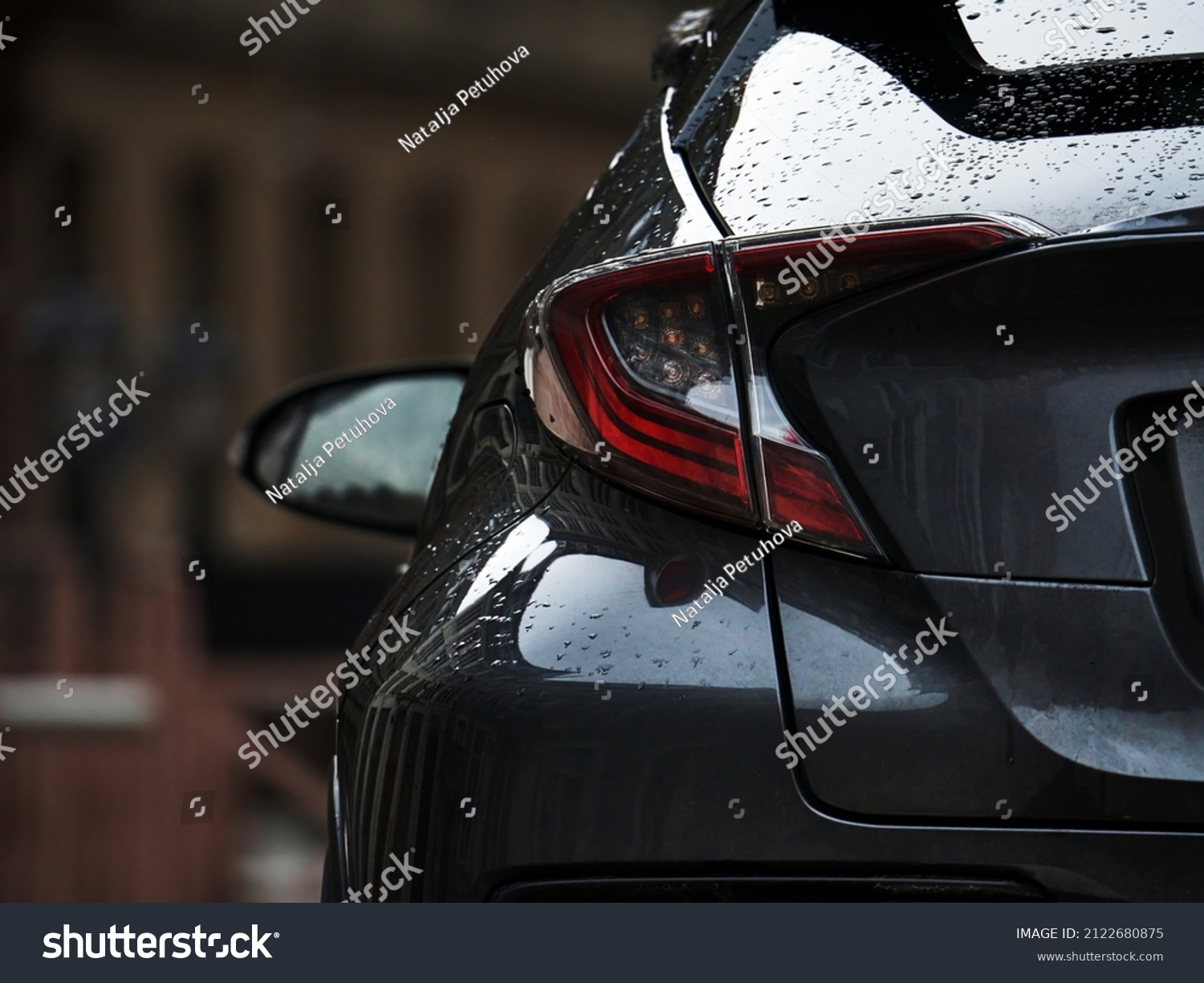 Detail on the rear light of a car. Grey car rear light close up #2122680875