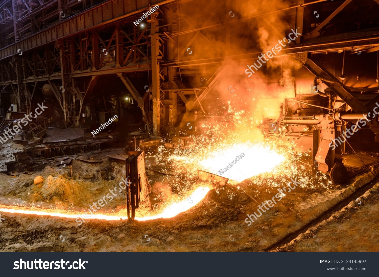 The flow of molten hot metal, molten steel flows along the guide chute. Blast furnace #2124145997