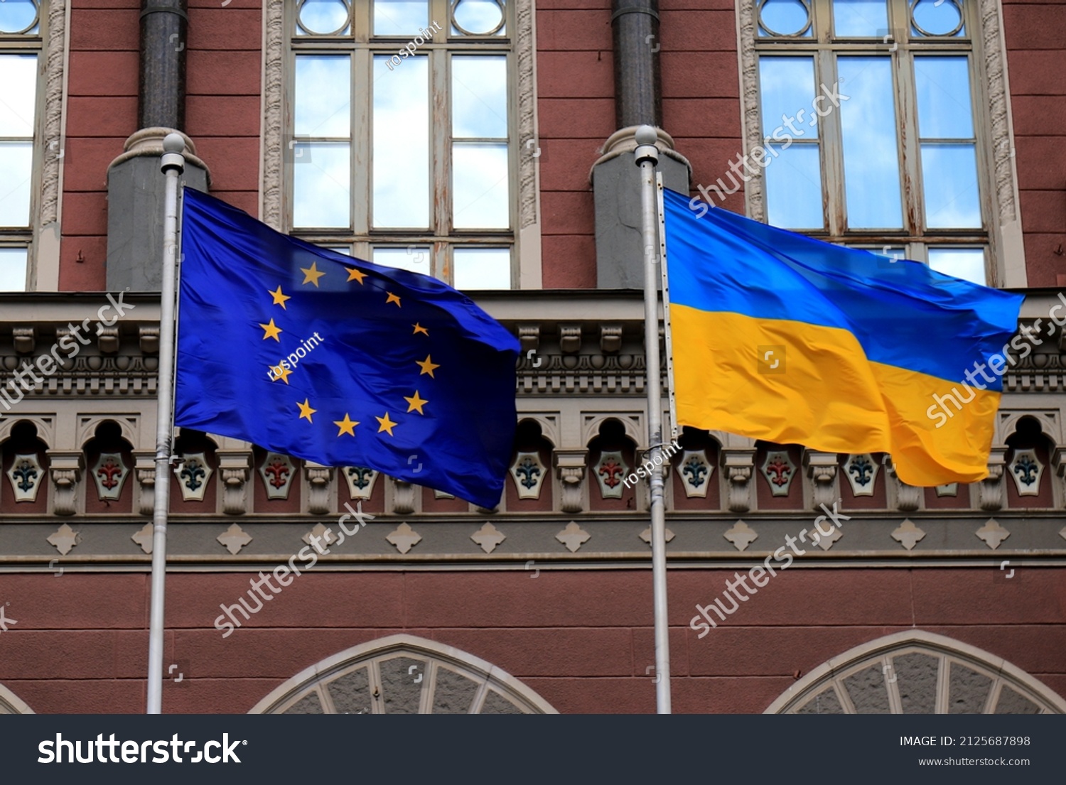 Flags of Ukraine and European Union in Kiev. Yellow-blue state Ukrainian and European Union flags in Kyiv, near  National Bank, Independence Constitution Day, National holiday. #2125687898