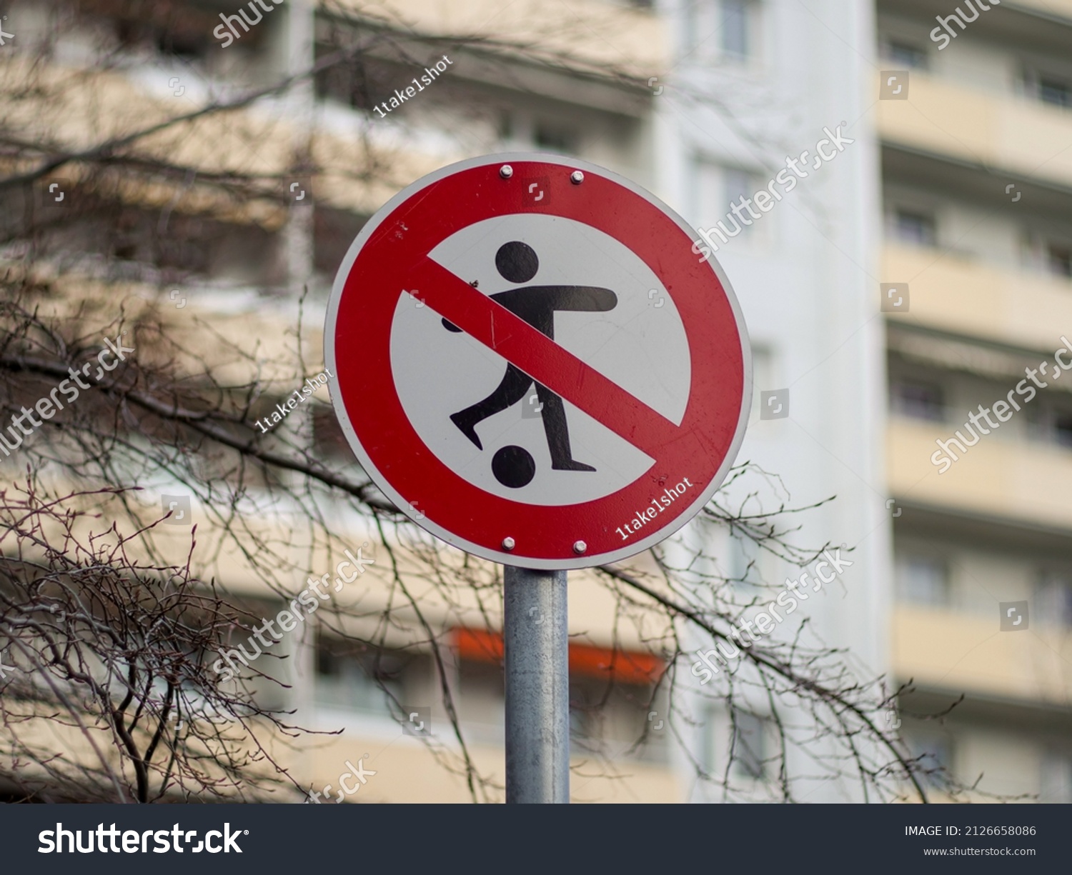 No ball games allowed sign in a residential neighborhood. Restriction for children in the area. Prohibition to play football in Germany. It is forbidden to have fun. #2126658086