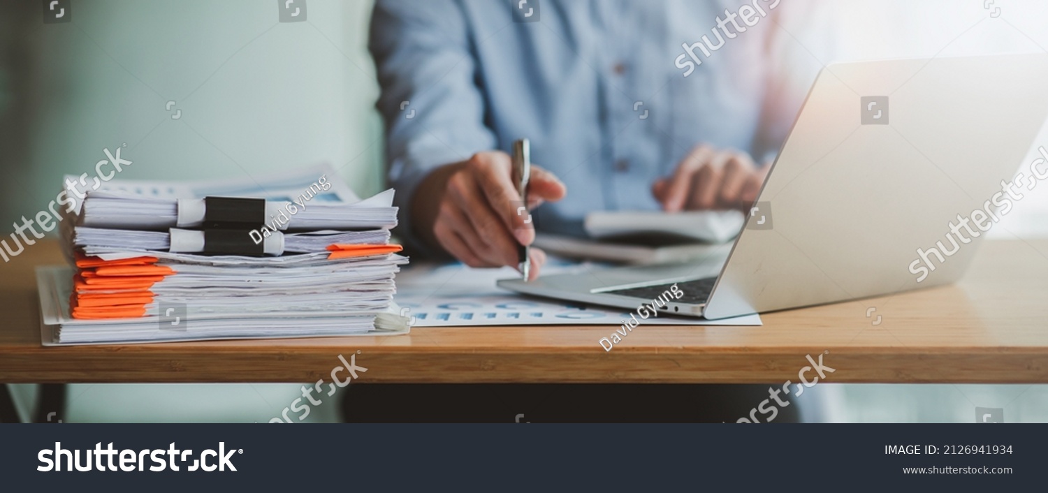 Business Documents, Auditor businesswoman checking searching document legal prepare paperwork or report for analysis TAX time,accountant Documents data contract partner deal in workplace office #2126941934