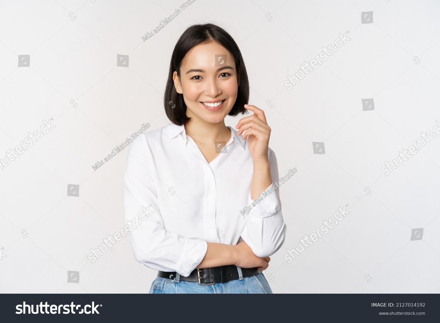 Young asian woman, professional entrepreneur standing in office clothing, smiling and looking confident, white background #2127014192