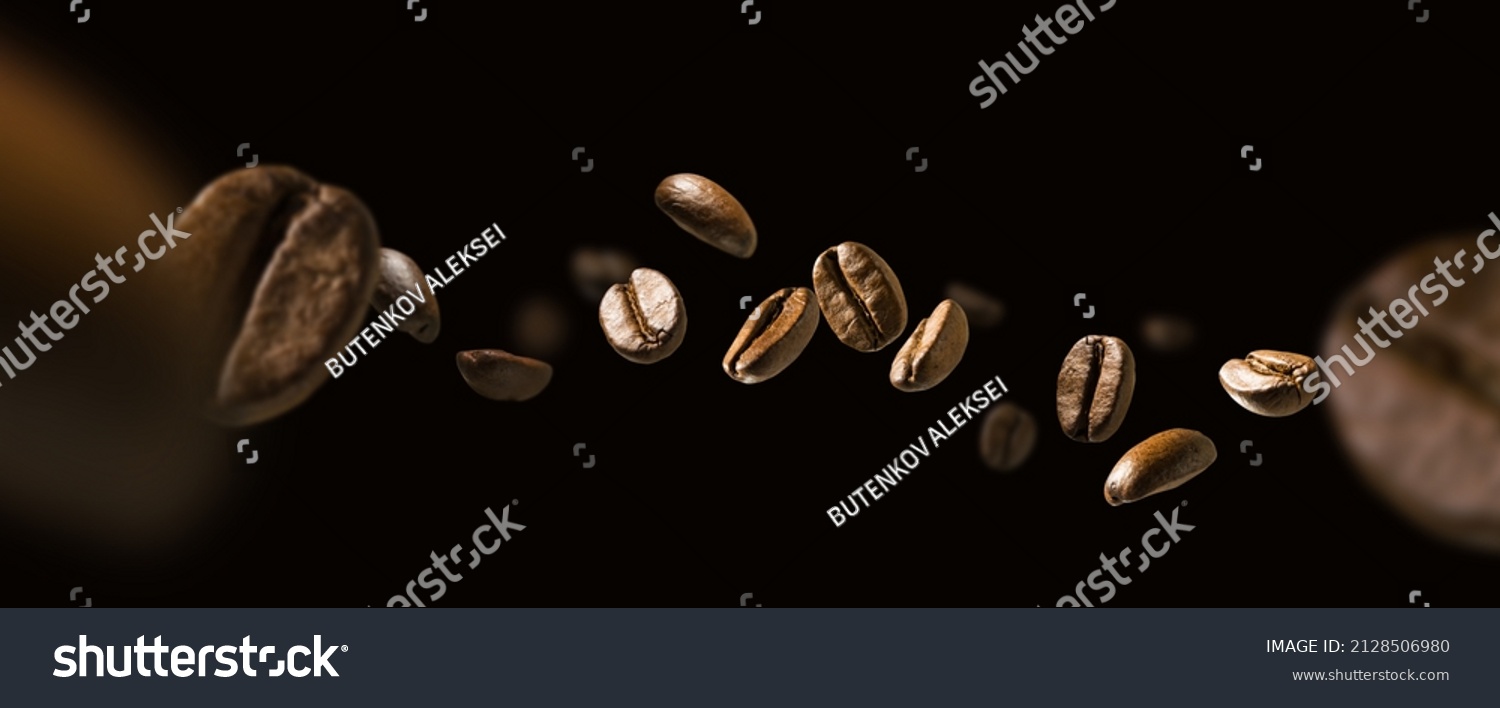 Coffee beans in flight on a dark background #2128506980