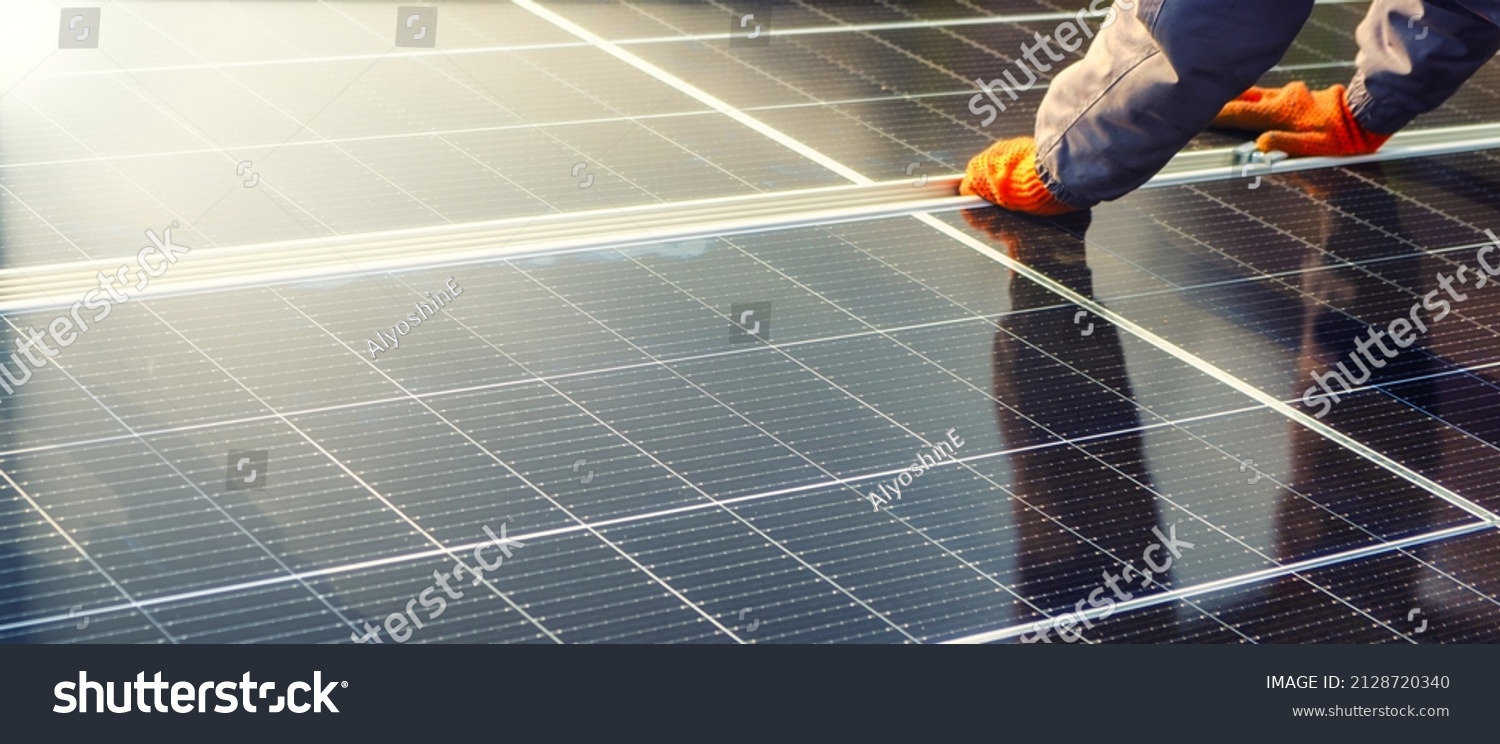 Close-up of solar cell, installing solar cell farm power plant eco technology. Solar cell panels in a photovoltaic power plant. Concept work of sustainable resources hands worker installing solar cell #2128720340