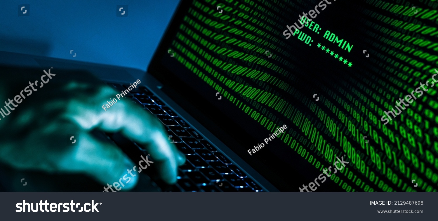 Hand typing on a laptop keyboard green numbers on display. Successful login with credentials user and password in the system. Technology communication, security protection, hacker, cyber crime concept #2129487698