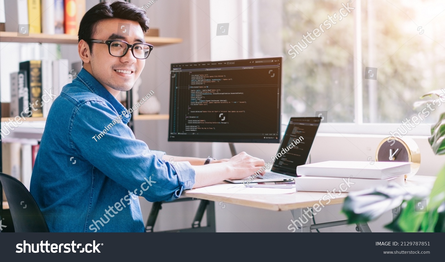 Young Asian programmer working at office #2129787851