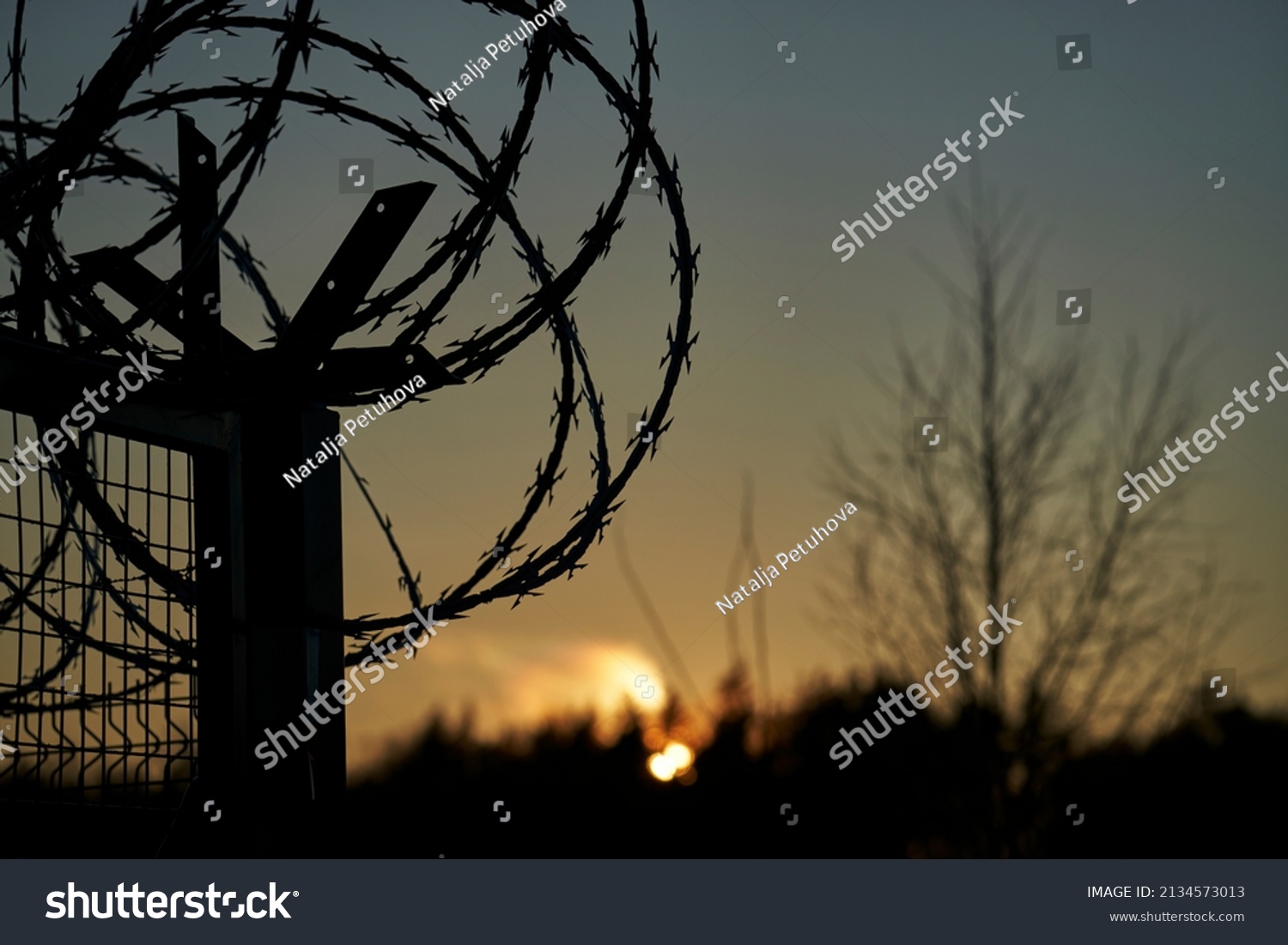 Barbed wire fence and Light of Hope. #2134573013