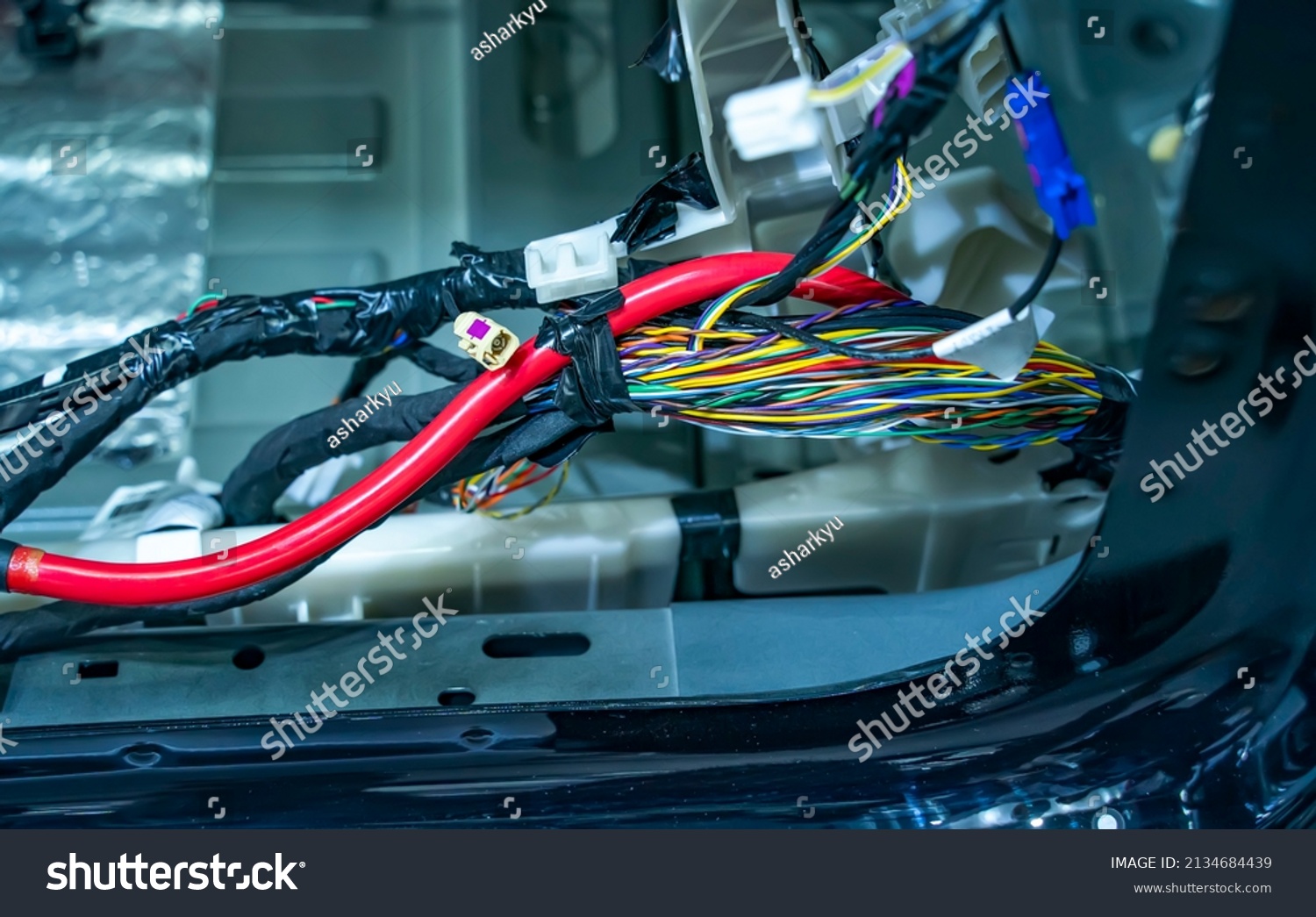 Large wide cable with wires and connectors and terminals in the wiring repair shop and electricians for connecting   #2134684439