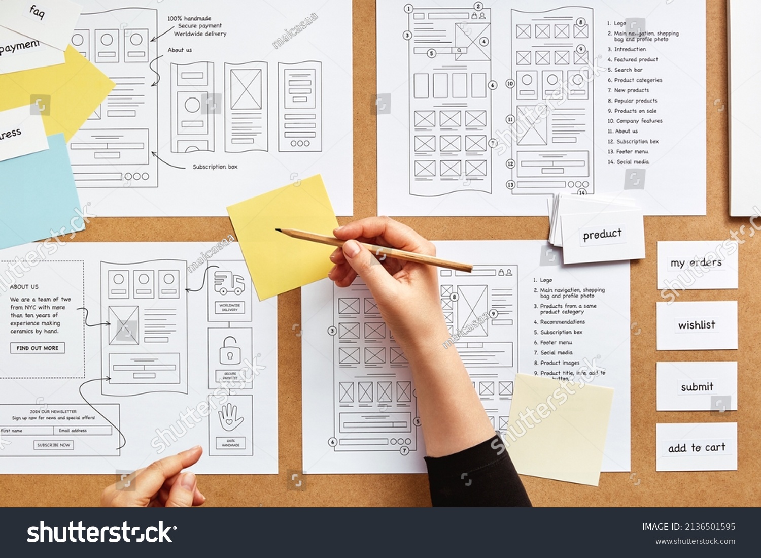 Web UX designer working on mobile responsive website project. Flat lay image of numerous website wireframe sketches and card sorting technique over product designer desk.  #2136501595