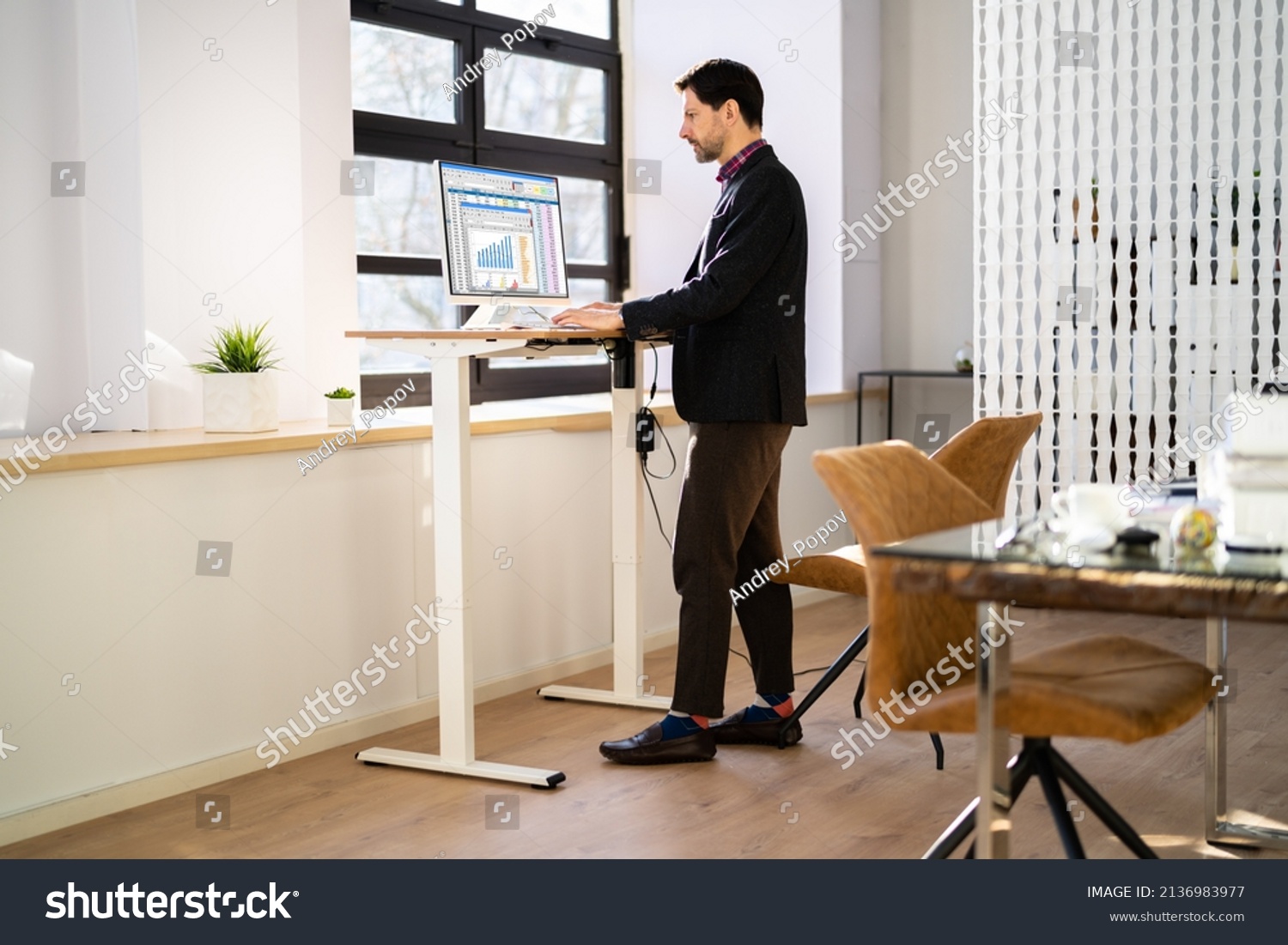 Adjustable Height Desk Stand In Office Using Computer #2136983977