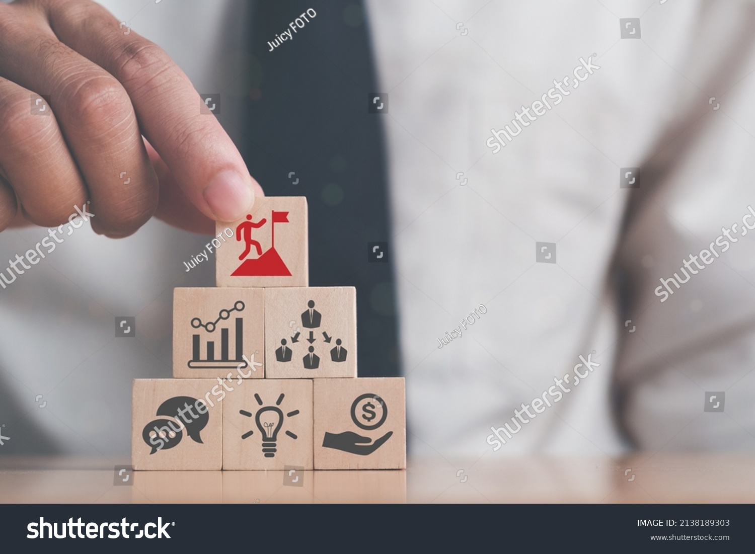 Business man puts the wooden cube with success icon standing with the success factors; experience, personal, network, relationship, vision. Leader and C-suite reaching concept. #2138189303