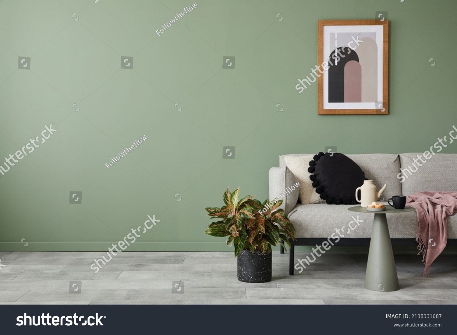 Creative living room interior composition with modern sofa, home decorations and personal accessories. Eucalyptus wall. Template. Copy space. #2138331087