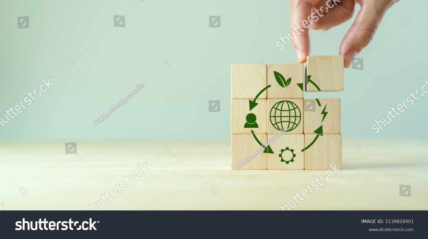 Circular economy concept, recycle, environment, reuse, manufacturing, waste, consumer, resources. LCA Life cycle assessment. Sustainability Wooden cubes; symbol of circular economy on grey background. #2139828401