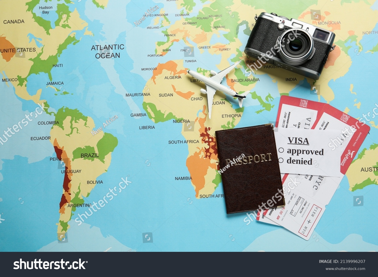 Flat lay composition with passport and tickets on world map. Space for text #2139996207