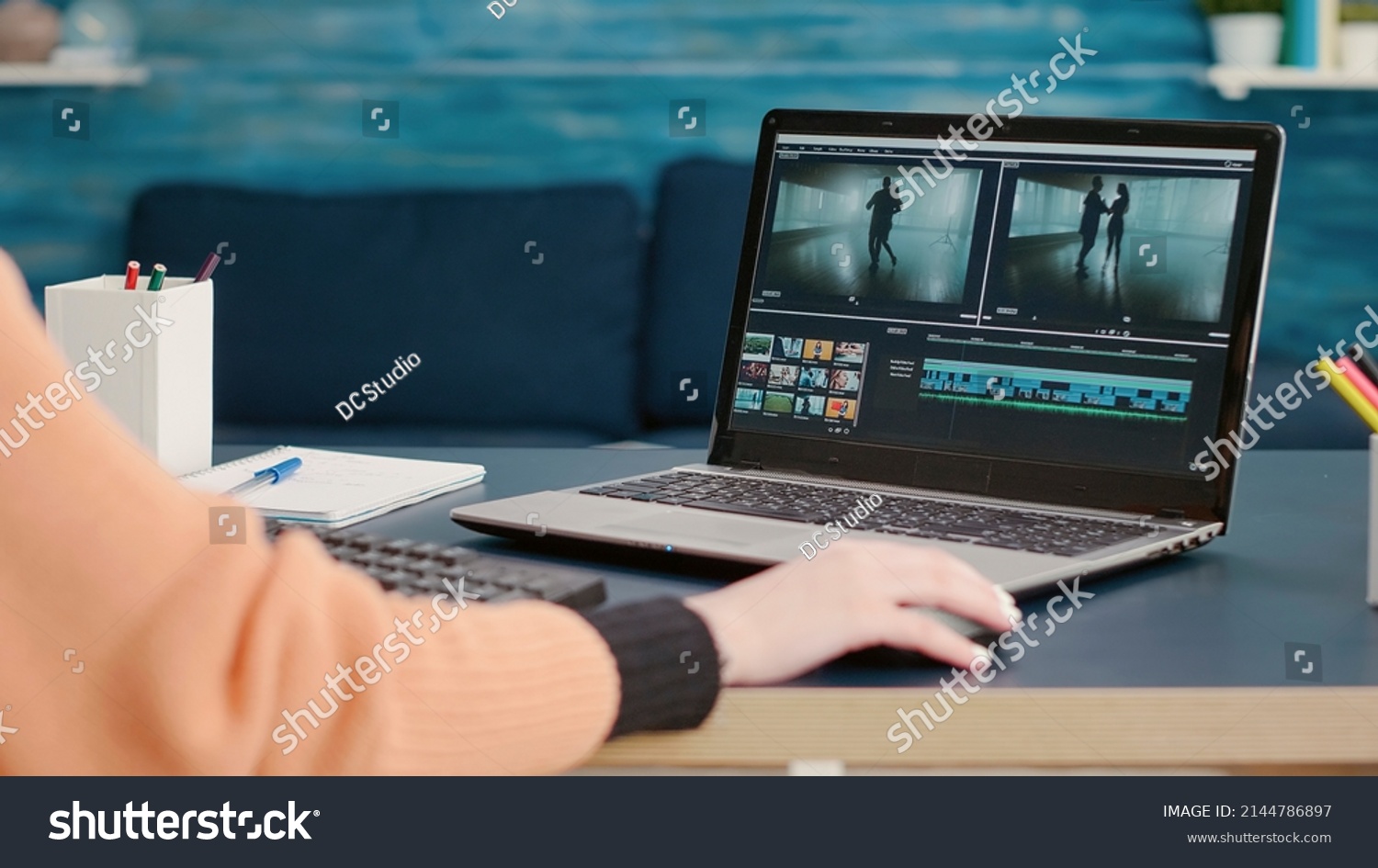 Content creator editing video montage on film production software, using laptop to learn for online class course. Student working on movie making development, creating multimedia footage. #2144786897