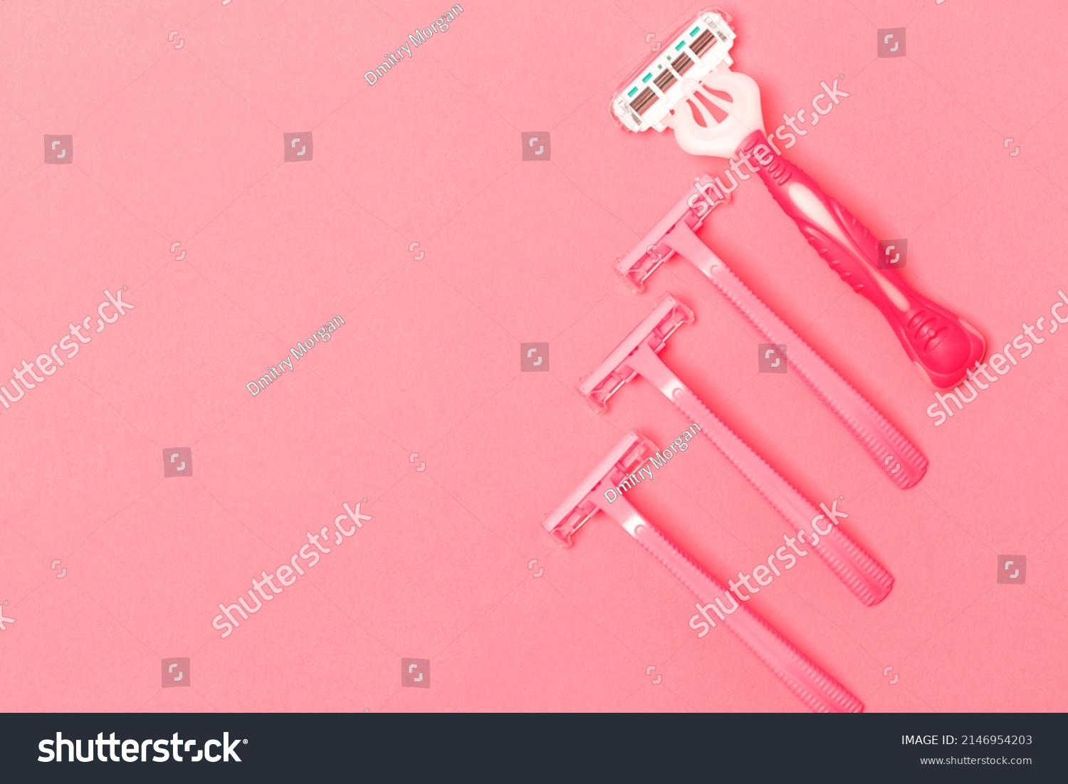 Variety of Four Female Pink Disposable Razors Shavers Placed Together Over Trendy Pink Coral Background. Horizontal image #2146954203