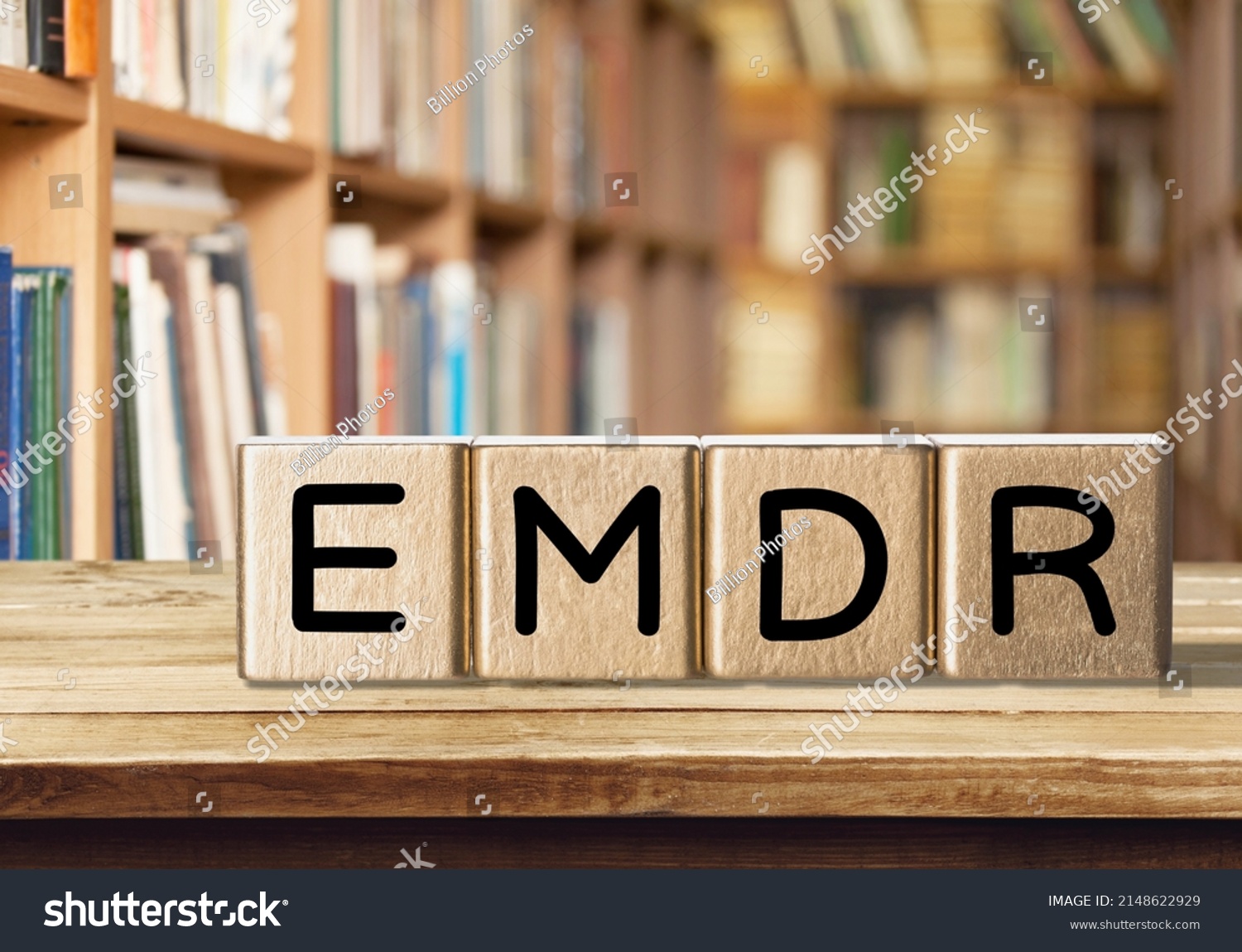 Wooden irregular blocks for letters on library background. EMDR on woden blocks. #2148622929