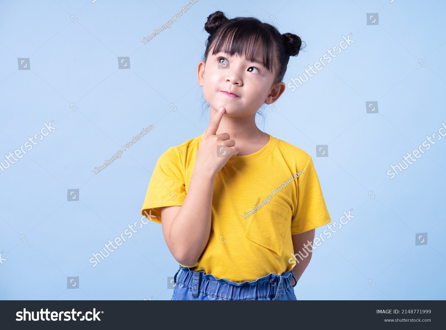 Image of Asian child posing on blue background #2148771999