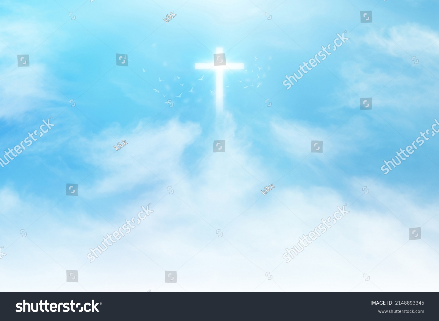 Christian cross appears bright in the sky background and soft clouds. with the light shining as Love. hope and freedom of God Jesus. #2148893345