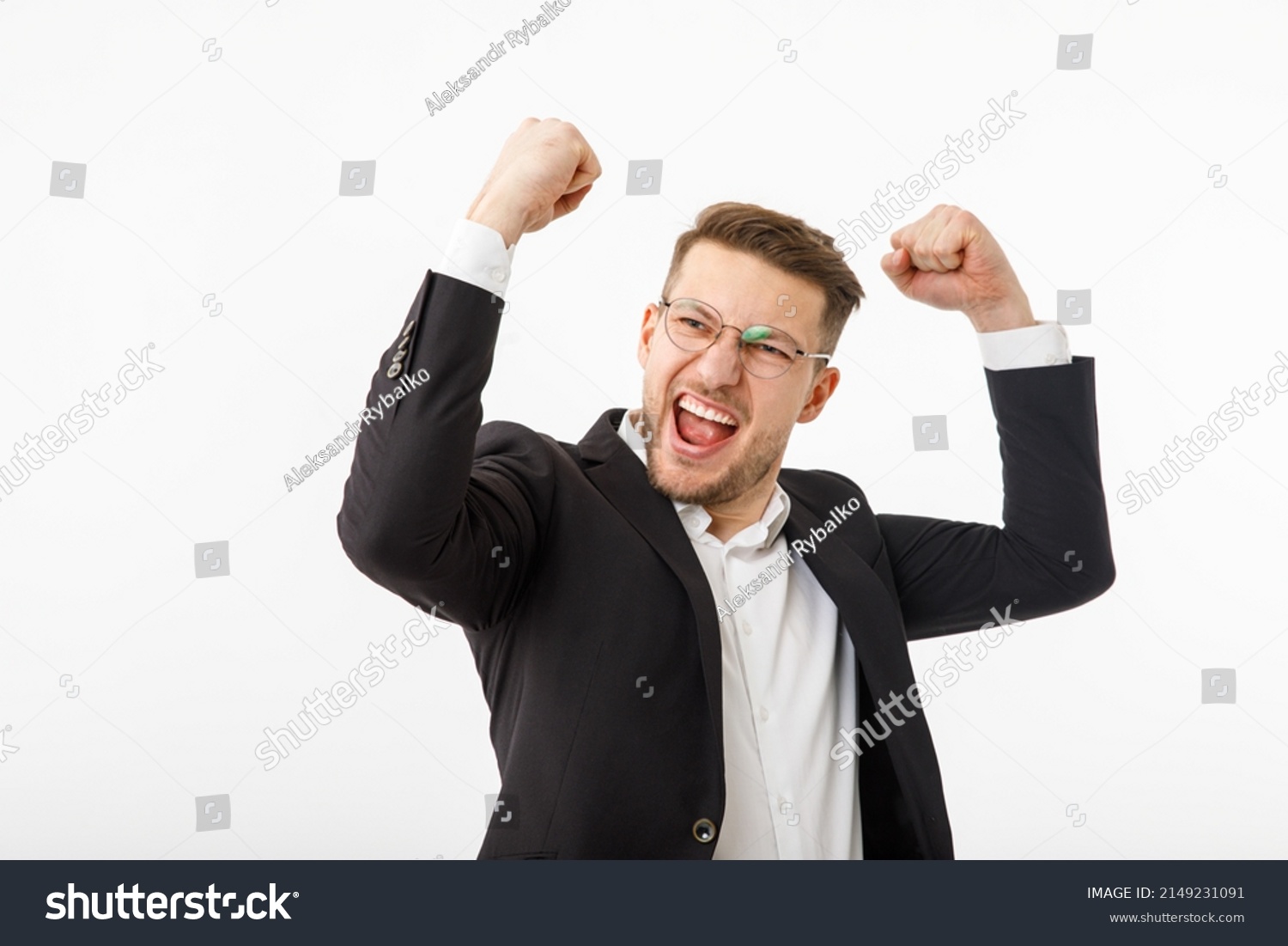 A jubilant businessman white background. A man in a business suit rejoices at success #2149231091