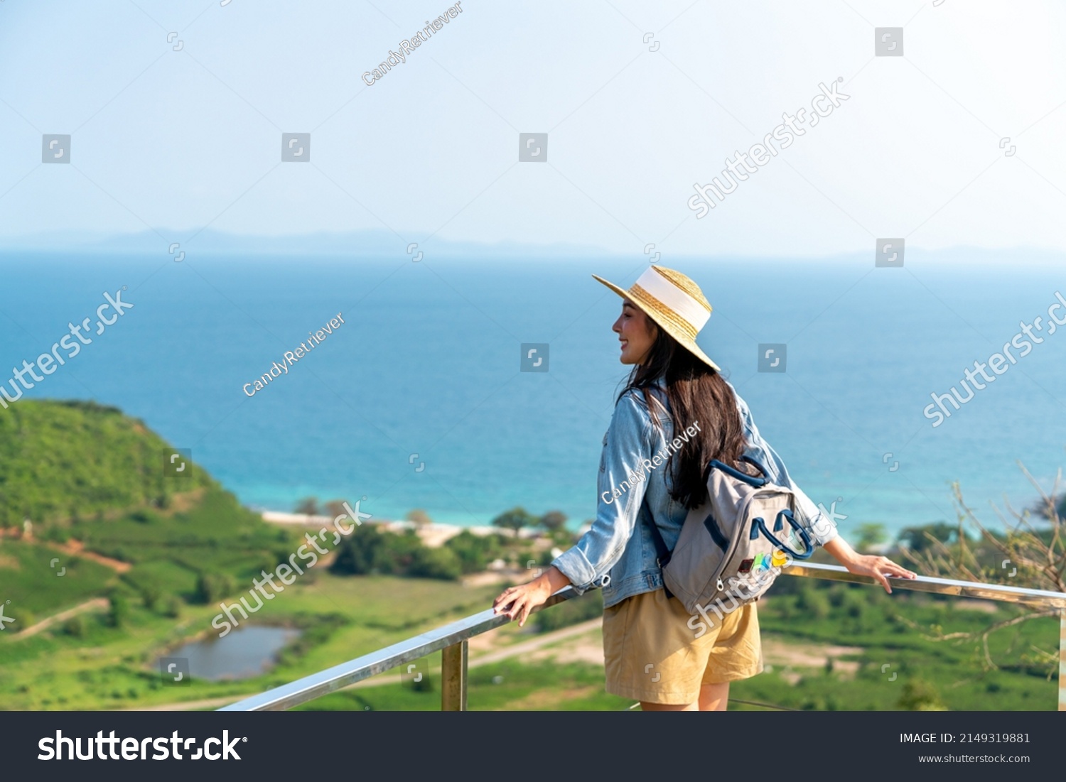 4K Young beautiful Asian woman with backpack solo travel on tropical island mountain peak in summer sunny day. Cheerful female relax and enjoy outdoor lifestyle in summer beach holiday vacation trip #2149319881