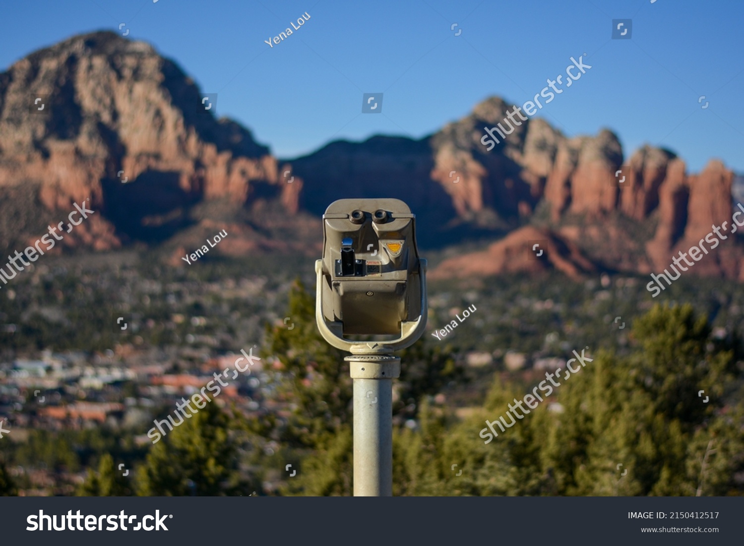 Telescope in front of iconic red rock beside Sedona Airport Scenic Lookout in Sedona Arizona #2150412517