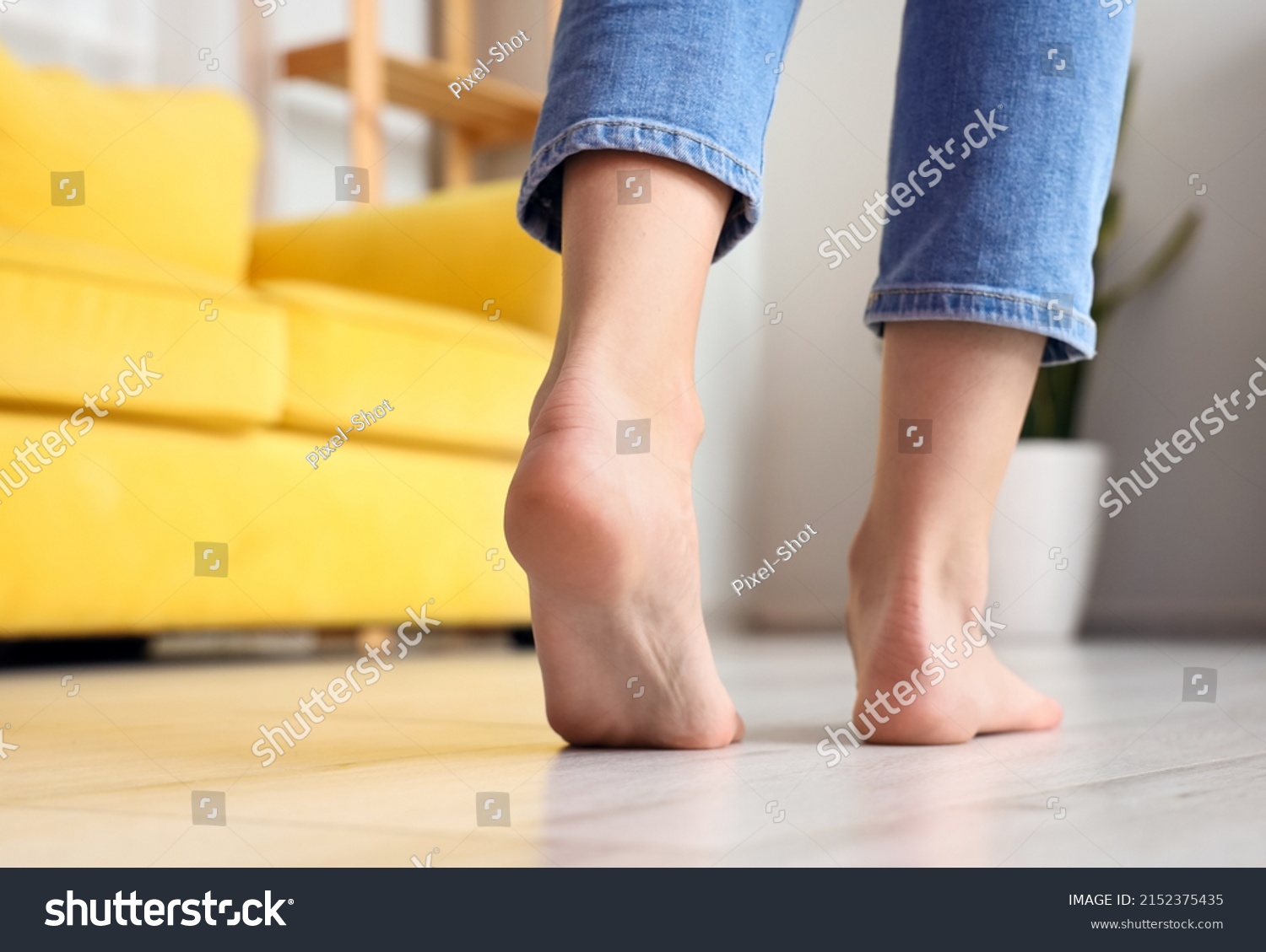 Woman with bare feet at home, closeup #2152375435