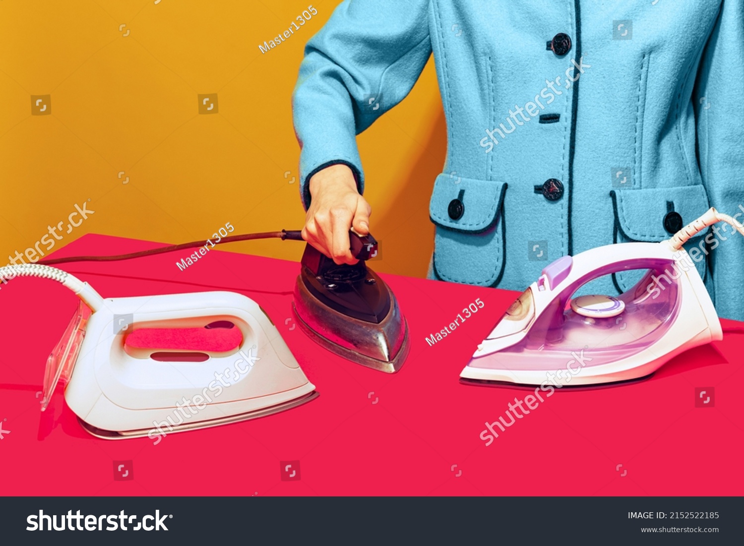 Colorful bright image of female ironing pink tablecloth with retro iron isolated over yellow background. Modern devices and retro things. Concept of vintage pop art, mix of times. Copy space for ad #2152522185