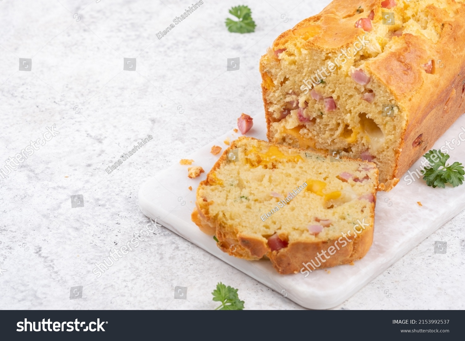 Savory ham and cheese loaf on cutting board #2153992537