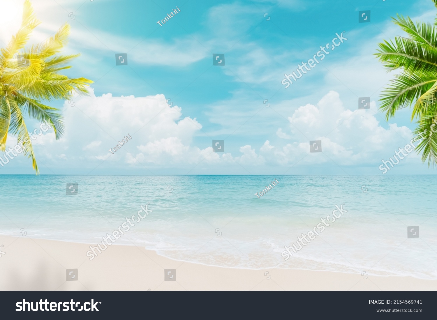 Palm tree on tropical beach with blue sky and white clouds abstract background. Copy space of summer vacation and business travel concept. Vintage tone filter effect color style. #2154569741