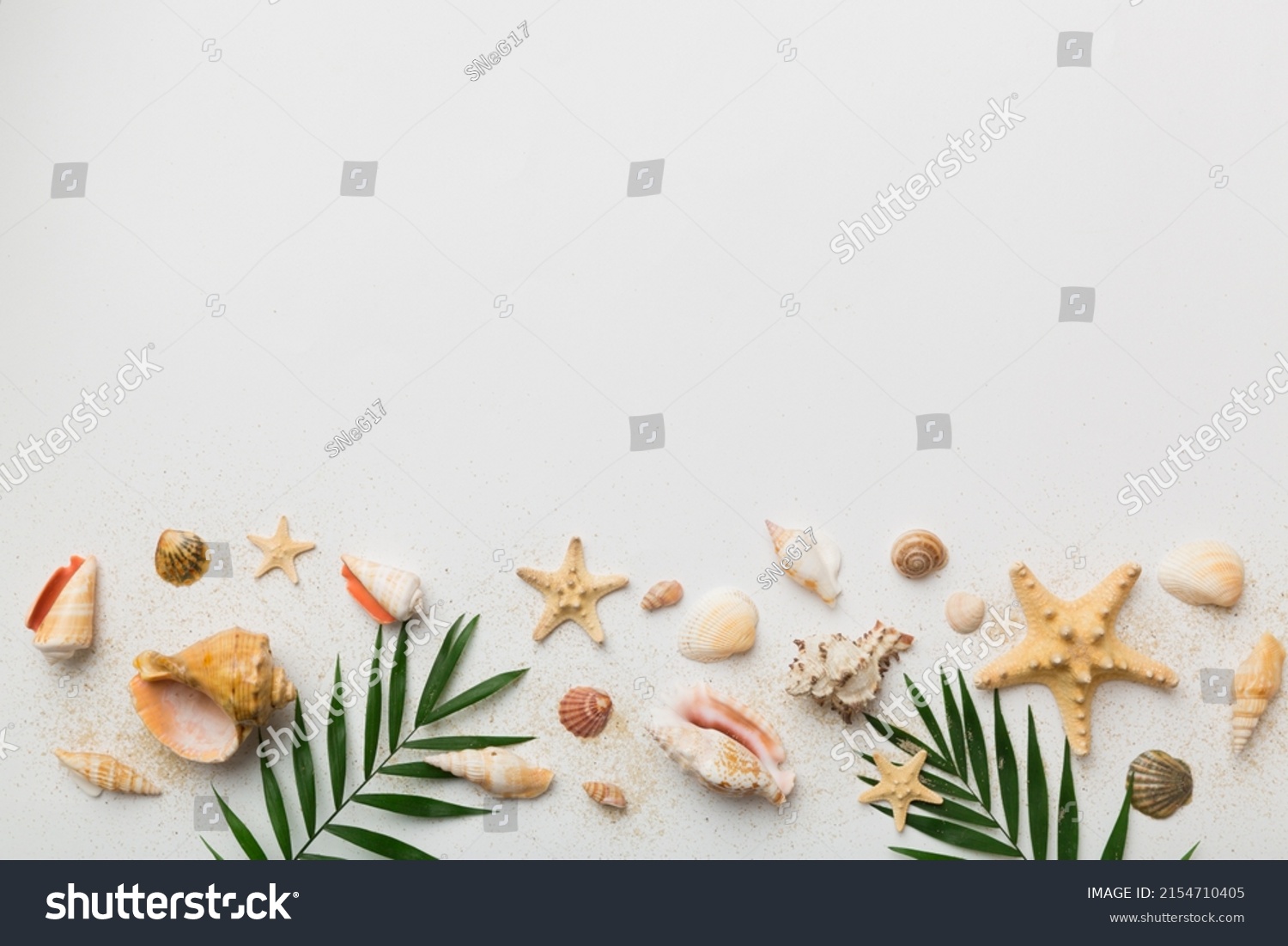 Summer time concept Flat lay composition with beautiful starfish and sea shells on colored table, top view with copy space for text. #2154710405