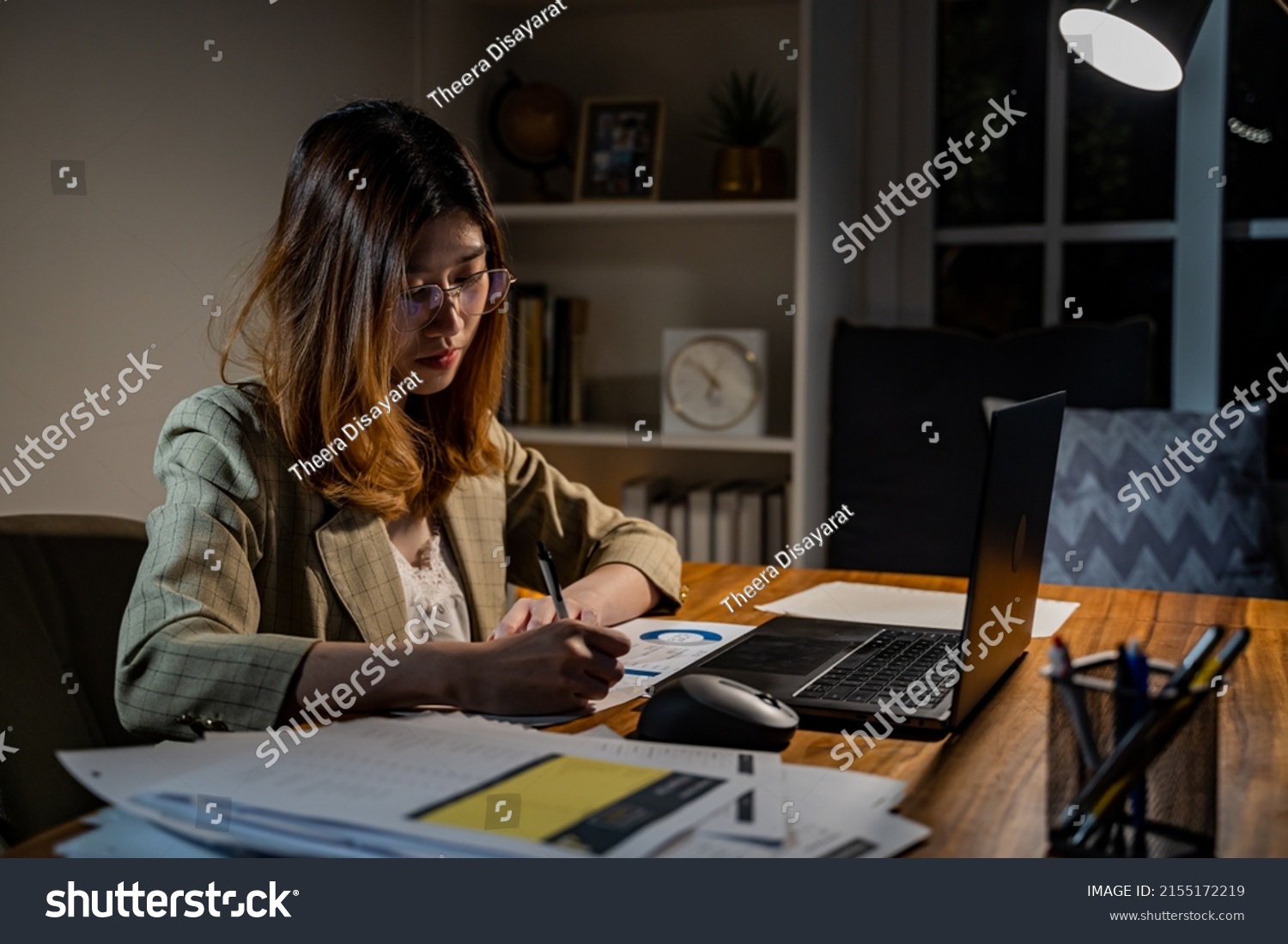 Asian businesswoman online working at the night. Busy and exhausted of work overtime at home #2155172219