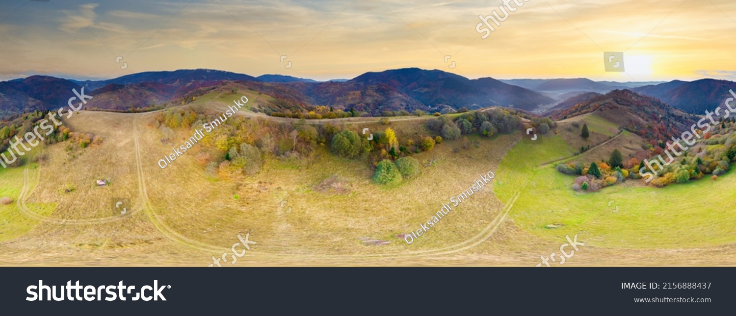 Ukraine. Sunrise shines in the Carpathians, colored fog spreads over the valleys and lowlands of the mountain range, golden prairies are very dazzlingly beautiful. #2156888437