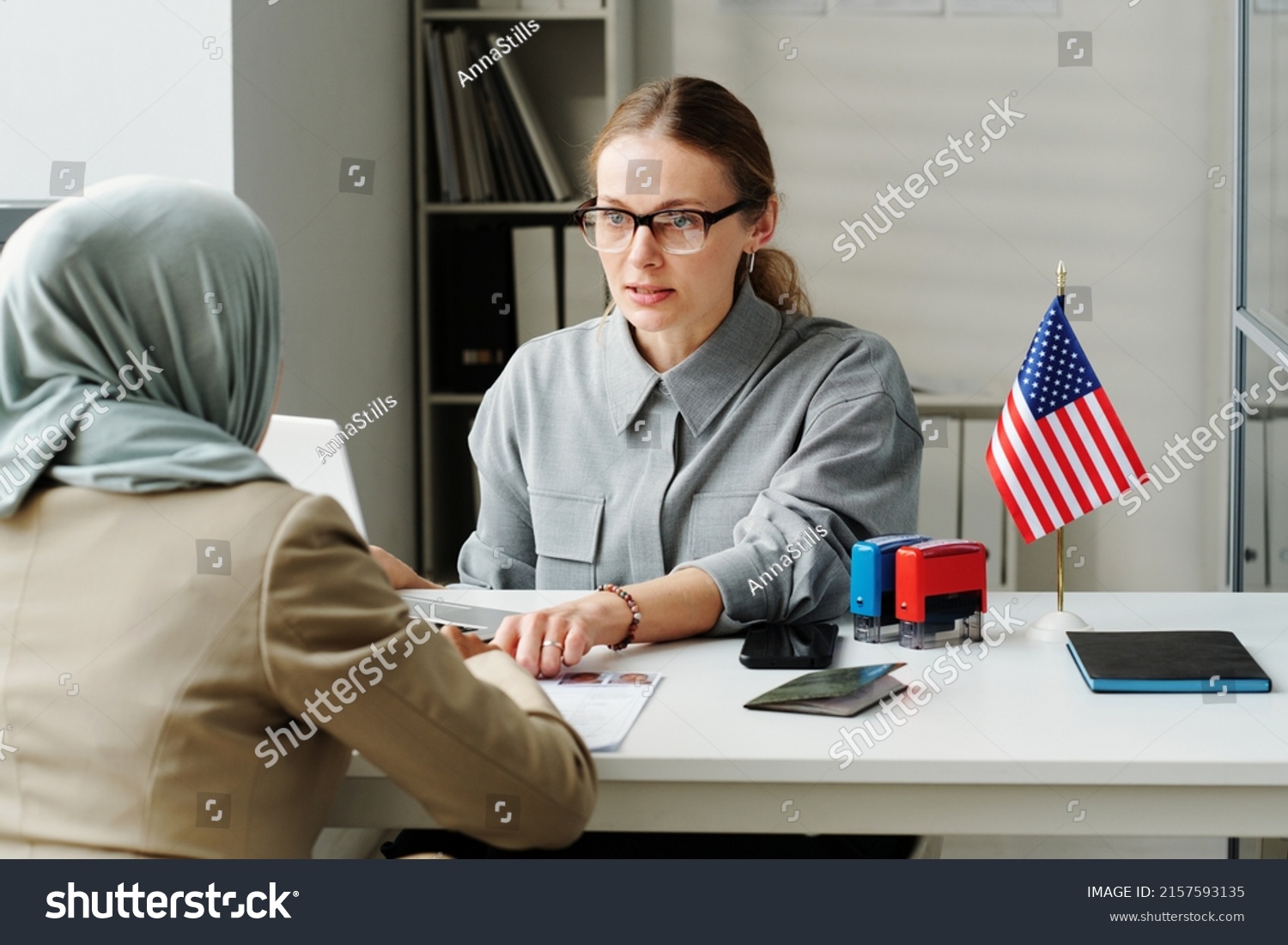 Consular Officer Working With Muslim Woman #2157593135