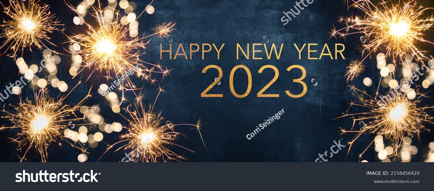HAPPY NEW YEAR 2023, New Year's Eve Party background greeting card  - Sparklers and bokeh lights, on dark blue night sky #2158456429