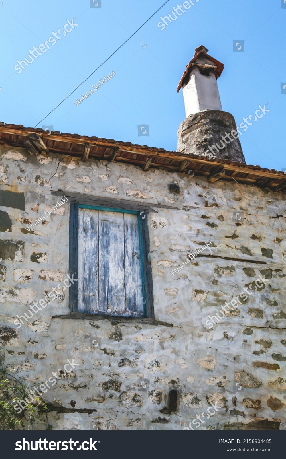 Wooden shutters on stone house. Ano Chora village, Nafpaktia. #2158904485