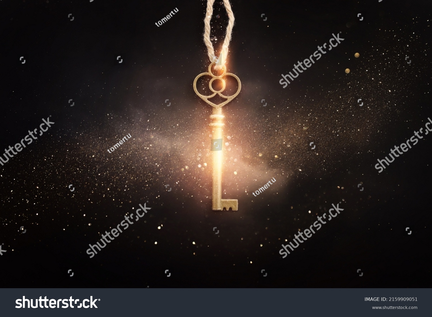 Golden key with glowing lights and dark background, wisdom, wealth, and spiritual concept #2159909051