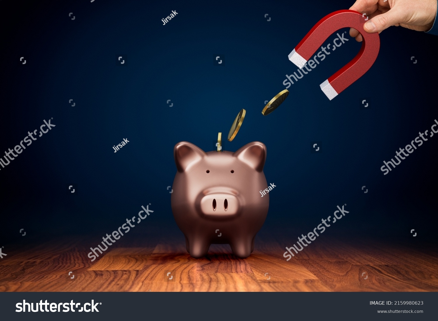 Inflation reduces the value of savings. Inflation concept with hand holding magnet takes away coins from piggy bank. Inflation is a threat to all savers. Tax, charge fee or handling charge concepts. #2159980623