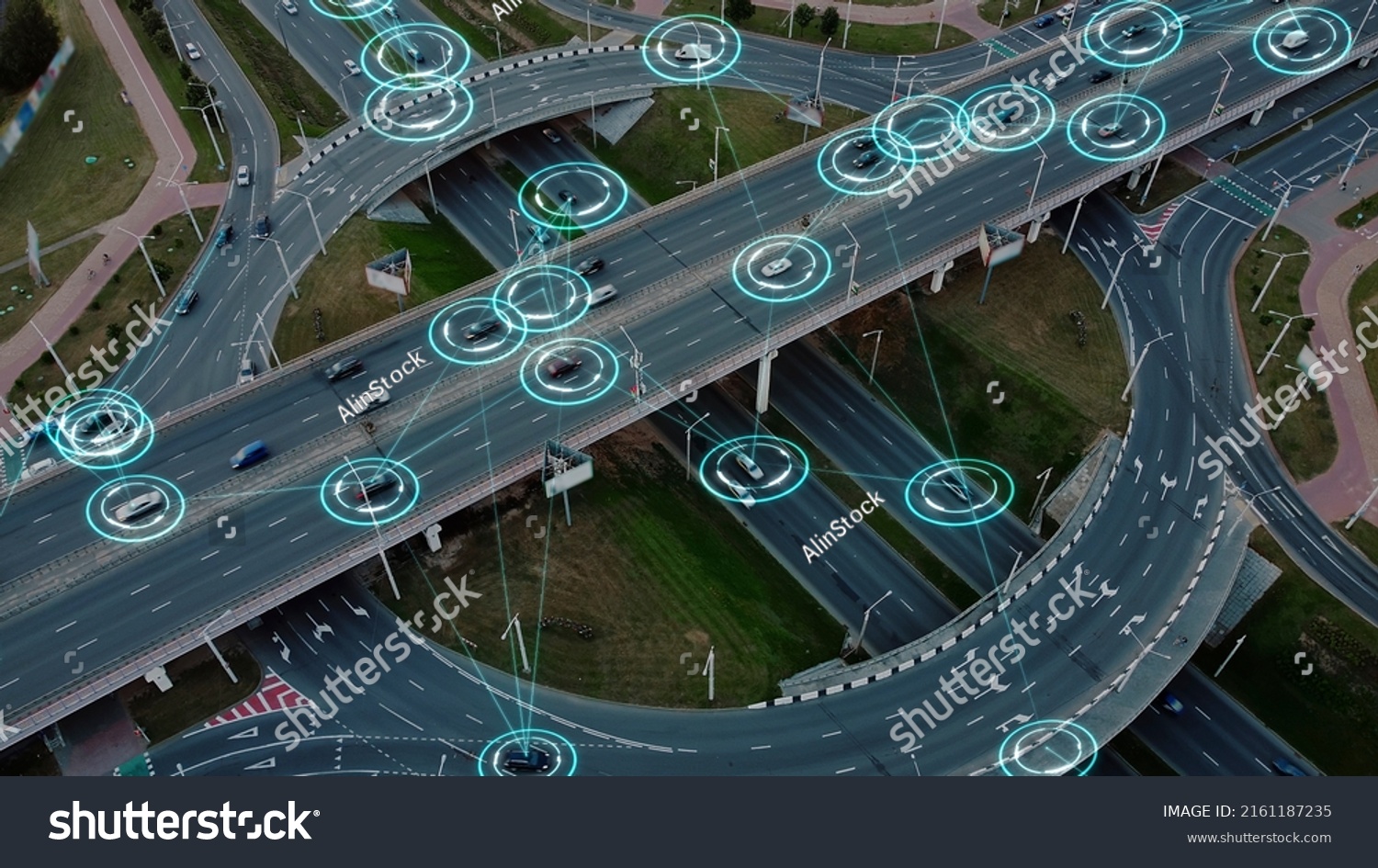 Aerial view: Self-driving autonomous electric cars of the future with HUD elements move along a busy traffic intersection. Concept: Artificial Intelligence, Car Scan, GPS Tracking, Smart Roads, IoT. #2161187235