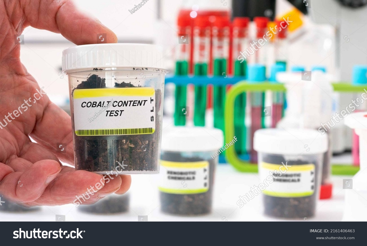 Cobalt. Cobalt content in soil sample in plastic container. Study of agricultural soil in a chemical laboratory #2161406463