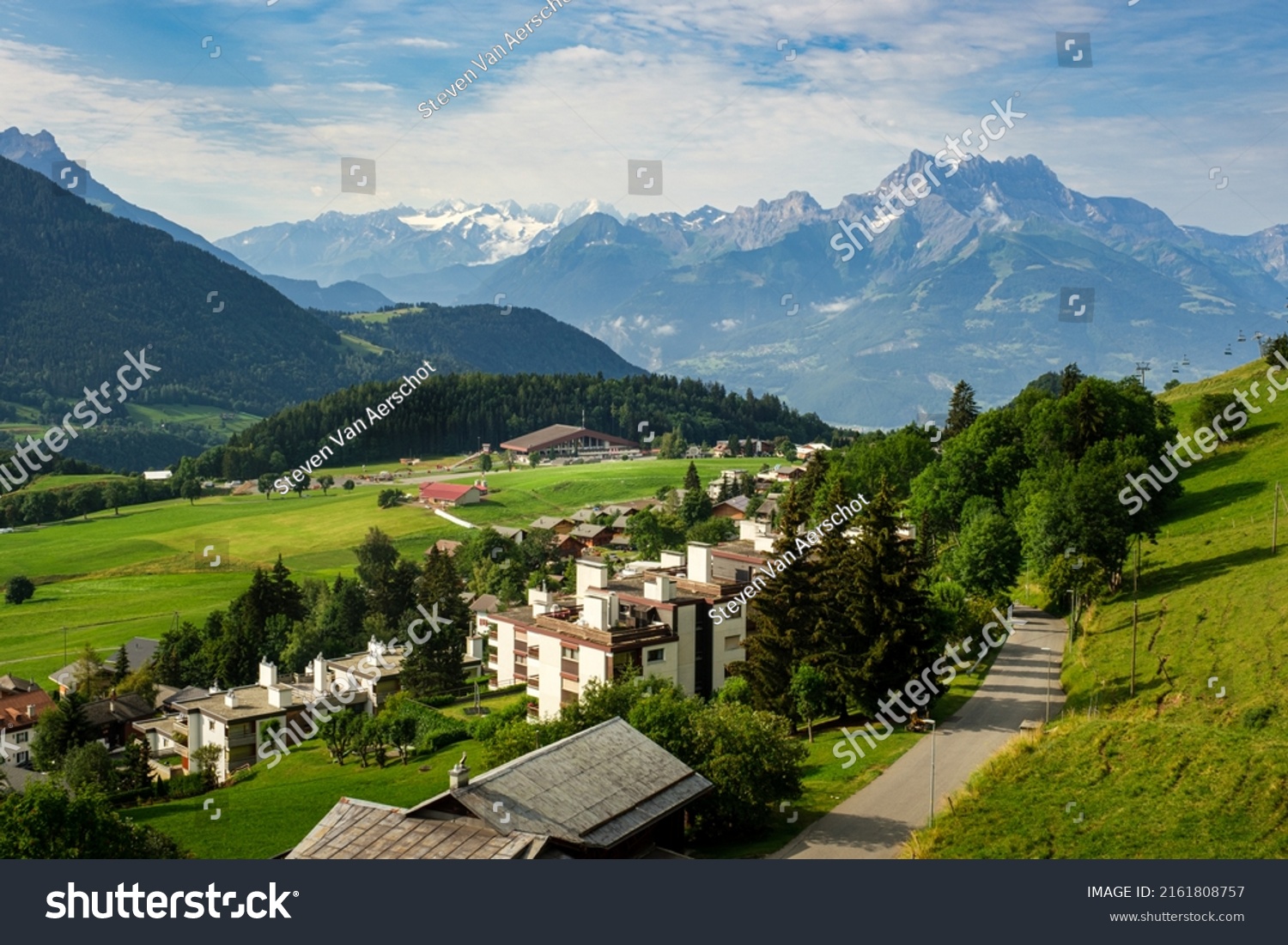 Beautiful view on swiss village Leysin and green alpine pastures in the Vaud alps on a summer day #2161808757