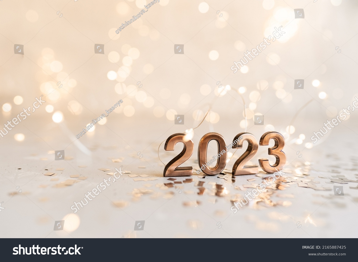 happy new year 2023 background new year holidays card with bright lights,gifts and bottle of hampagne #2165887425