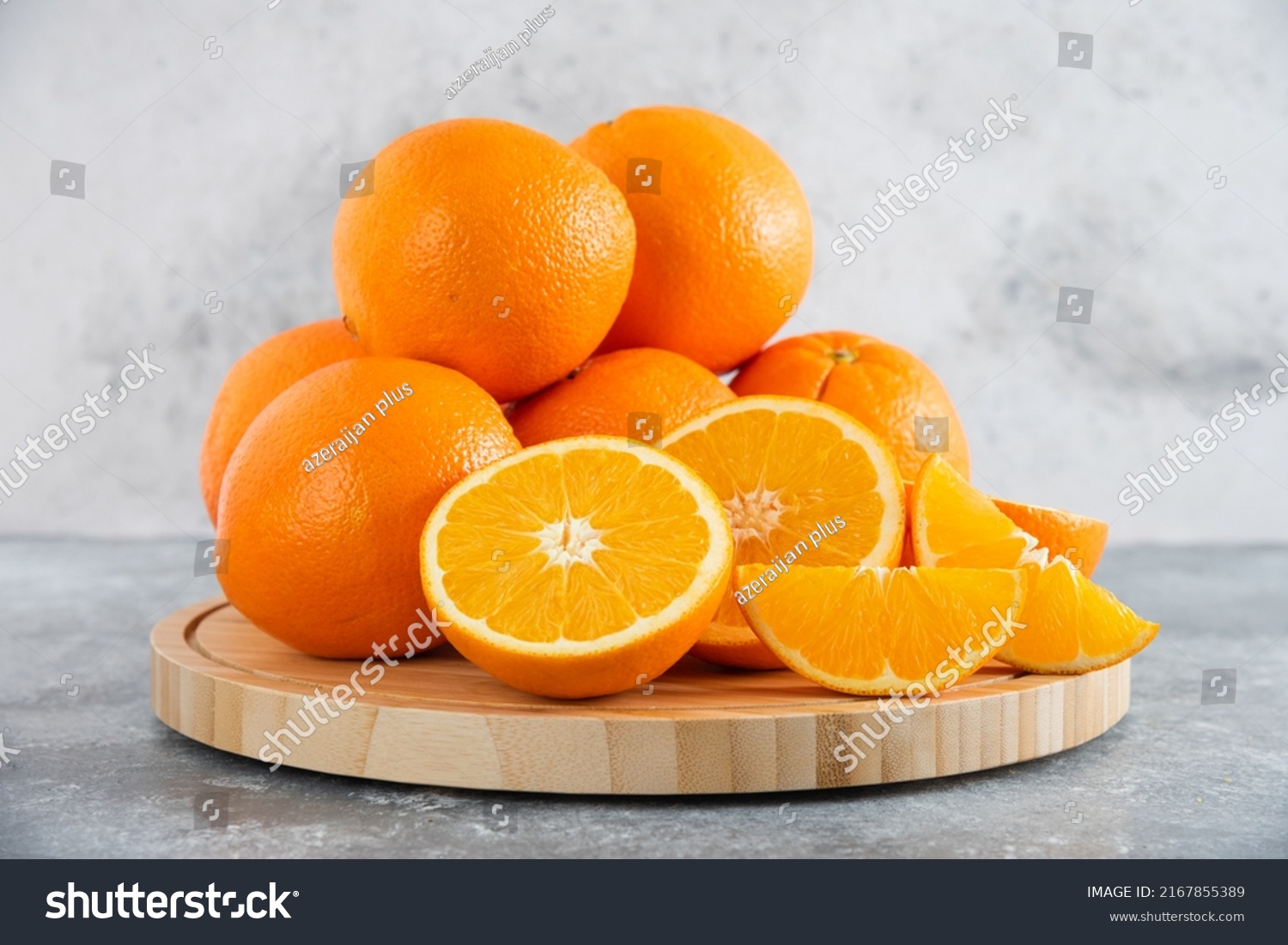 front view fresh sliced orange on dark background ripe mellow fruit juice color citrus tree citrus, Whole and sliced ripe oranges placed on marble background, half orange fruit. #2167855389