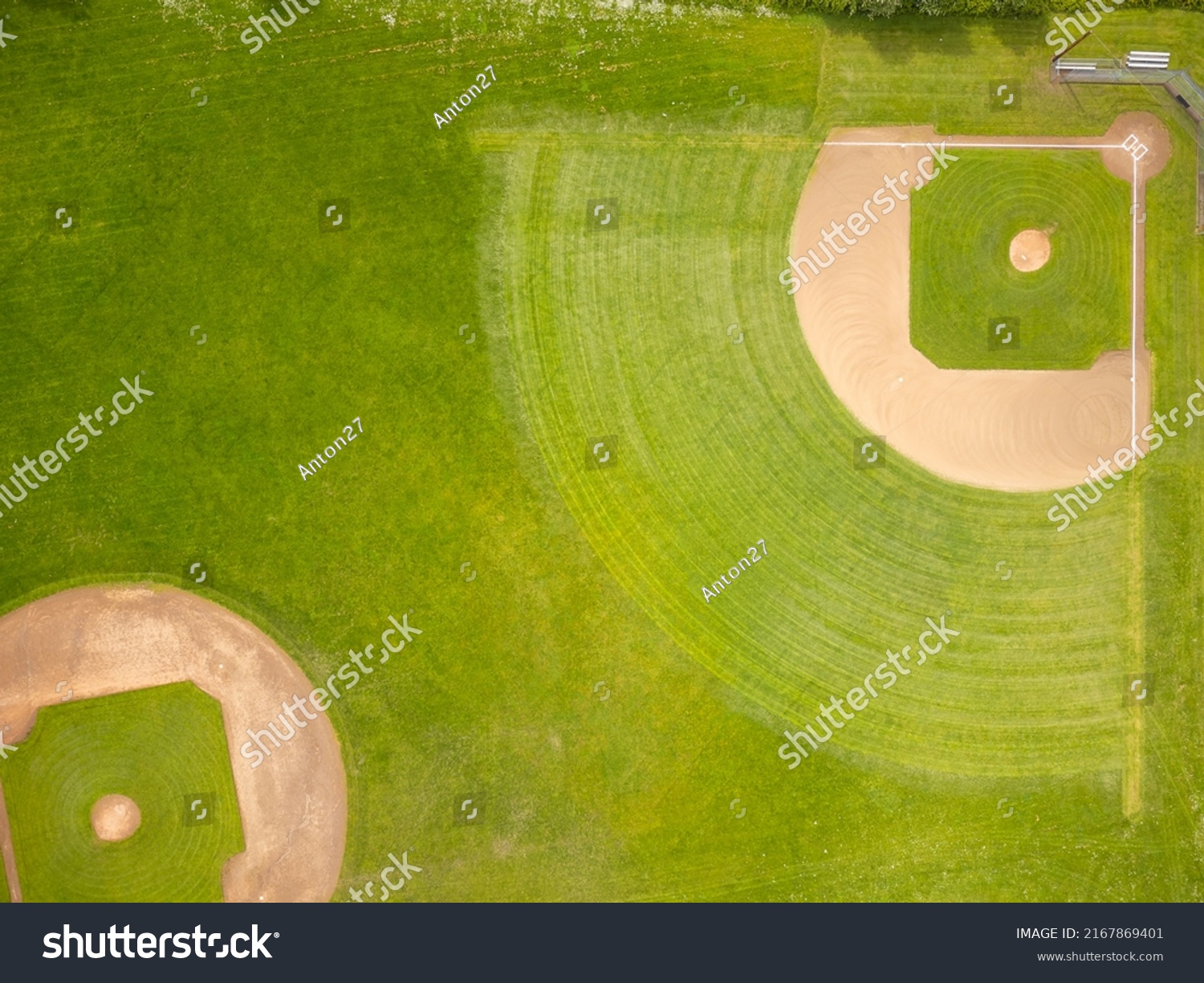 Green sports field with markings. View from above. Field for sports games - football, volleyball, rugby, golf. Abstraction. Minimalism. There are no people in the photo. There is free space to insert. #2167869401