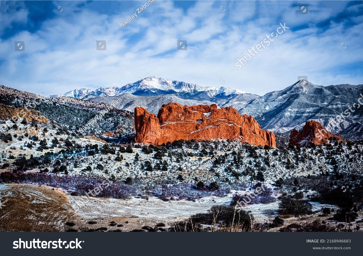 Red rocks of the snowy desert canyon. Canyon desert in snow. Snow covered canyon desert. Canyon desert landscape #2168946683